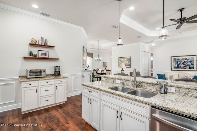 508 Lorelei Ave, Melbourne, FL 32901 - kitchen featuring a raised ceiling, dishwasher, ornamental molding, ceiling fan, and dark wood-style flooring