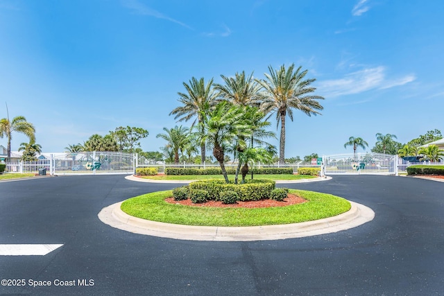 508 Lorelei Ave, Melbourne, FL 32901 - view of asphalt road featuring a gate, a gated entry, and curbs