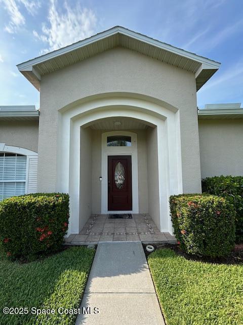 1932 Laramie Cir, Melbourne, FL 32940 - property entrance featuring stucco siding