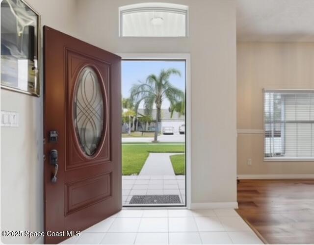 1932 Laramie Cir, Melbourne, FL 32940 - tiled foyer featuring baseboards