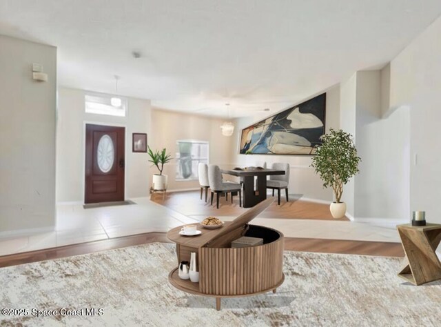 1932 Laramie Cir, Melbourne, FL 32940 - foyer featuring healthy amount of natural light, wood finished floors, and baseboards