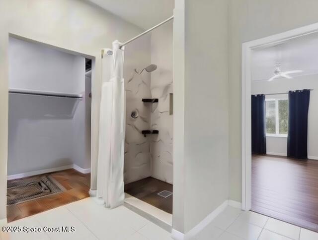 1932 Laramie Cir, Melbourne, FL 32940 - full bathroom featuring a shower with shower curtain, tile patterned flooring, and baseboards