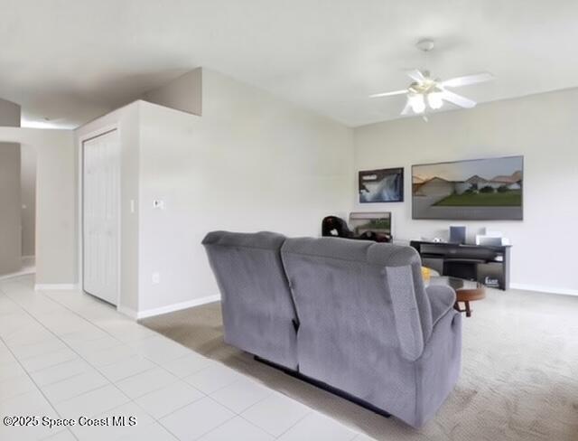 1932 Laramie Cir, Melbourne, FL 32940 - carpeted living area with ceiling fan and baseboards