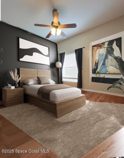1932 Laramie Cir, Melbourne, FL 32940 - bedroom featuring wood finished floors, ceiling fan, and baseboards