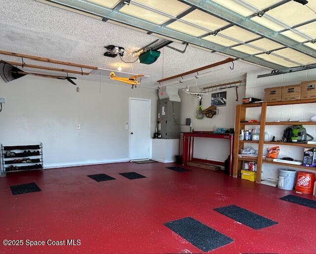 1932 Laramie Cir, Melbourne, FL 32940 - garage with baseboards and a garage door opener
