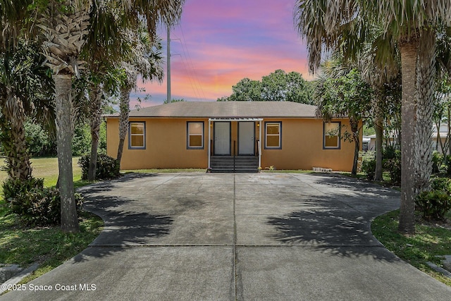 1230 Fern St Unit 1230 & 1232, Cocoa, FL 32922 - ranch-style home featuring stucco siding and concrete driveway