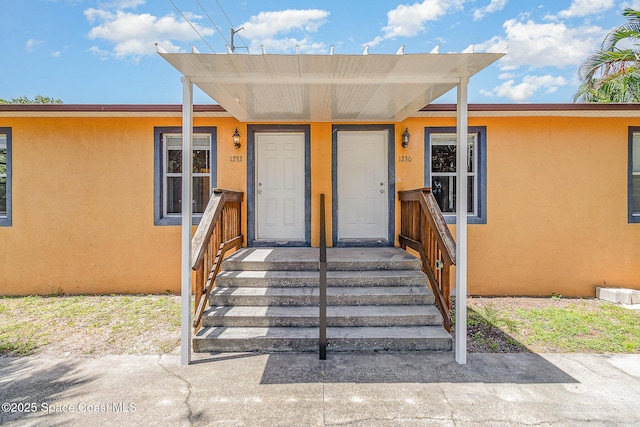 1230 Fern St Unit 1230 & 1232, Cocoa, FL 32922 - view of exterior entry with stucco siding