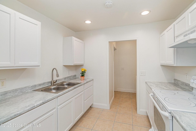 1230 Fern St Unit 1230 & 1232, Cocoa, FL 32922 - kitchen featuring electric range, white cabinetry, light countertops, light tile patterned floors, and recessed lighting