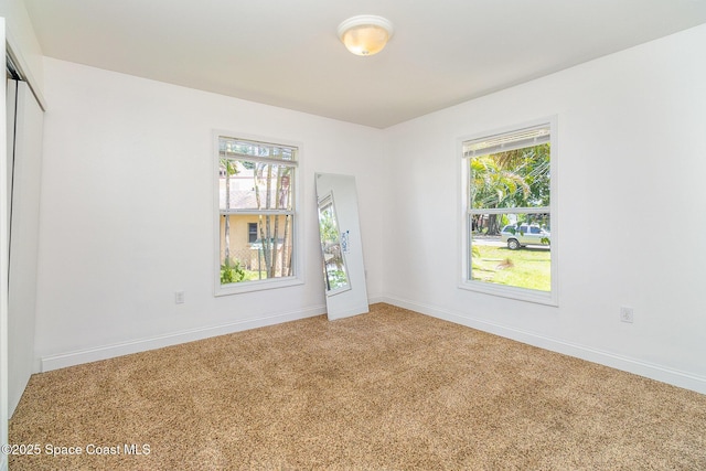 1230 Fern St Unit 1230 & 1232, Cocoa, FL 32922 - carpeted spare room featuring plenty of natural light