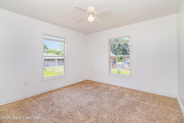 1230 Fern St Unit 1230 & 1232, Cocoa, FL 32922 - carpeted empty room featuring healthy amount of natural light and ceiling fan