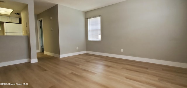 3143 Sir Hamilton Cir Unit 12, Titusville, FL 32780 - unfurnished room featuring light wood-style flooring and baseboards