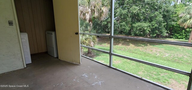 3143 Sir Hamilton Cir Unit 12, Titusville, FL 32780 - unfurnished sunroom featuring separate washer and dryer