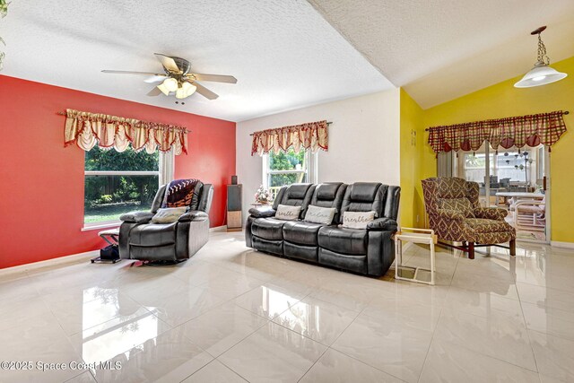 427 Falls Church St SW, Palm Bay, FL 32908 - living area featuring ceiling fan, a textured ceiling, and baseboards