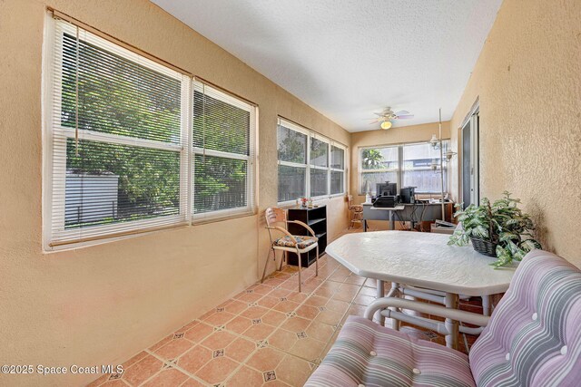 427 Falls Church St SW, Palm Bay, FL 32908 - sunroom featuring a textured wall, tile patterned floors, and a textured ceiling