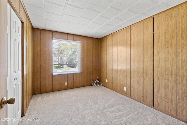 4545 Tina St, Cocoa, FL 32927 - spare room featuring carpet flooring and wood walls