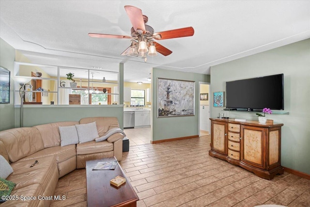 1225 Colby Ln, Merritt Island, FL 32952 - living area featuring a ceiling fan and baseboards