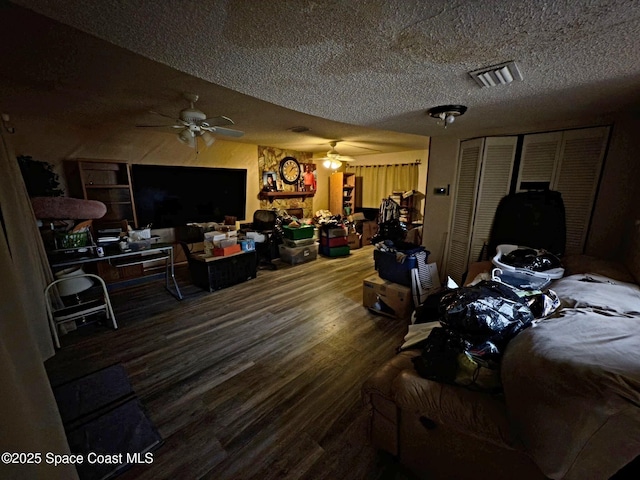 3454 Pheasant Ct, Melbourne, FL 32935 - bedroom with wood finished floors, a textured ceiling, and a closet