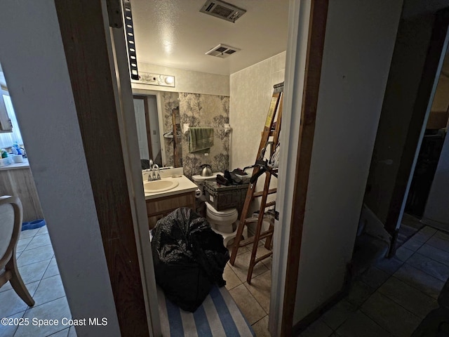 3454 Pheasant Ct, Melbourne, FL 32935 - bathroom featuring toilet, tile patterned floors, and vanity