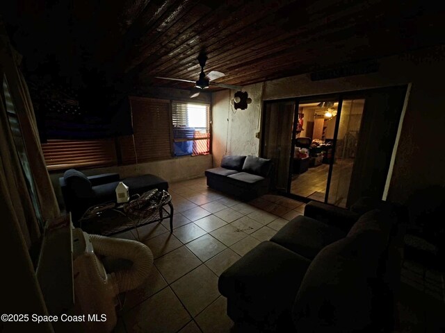 3454 Pheasant Ct, Melbourne, FL 32935 - living room with tile patterned floors, wood ceiling, and a ceiling fan