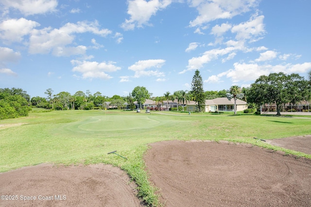 8002 Bradwick Way, Melbourne, FL 32940 - surrounding community featuring a lawn and view of golf course