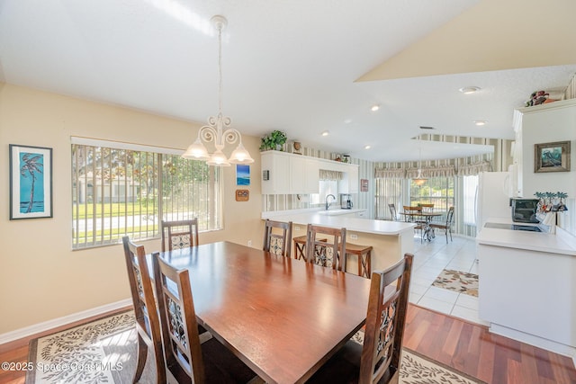 8002 Bradwick Way, Melbourne, FL 32940 - dining space featuring a chandelier and light wood-style floors