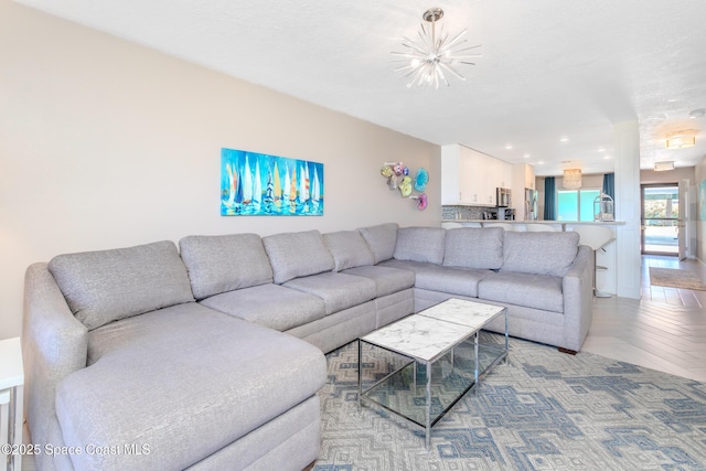 2880 S Atlantic Ave Unit 102, Cocoa Beach, FL 32931 - living area featuring a chandelier and recessed lighting