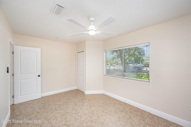 unfurnished bedroom featuring a closet, baseboards, and a ceiling fan