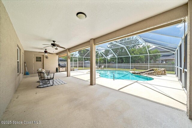 5863 Newbury Cir, Melbourne, FL 32940 - view of pool featuring a patio area, a fenced backyard, a ceiling fan, and a lanai