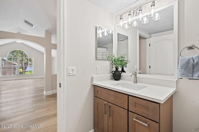 5863 Newbury Cir, Melbourne, FL 32940 - full bathroom featuring vanity, wood finished floors, and baseboards
