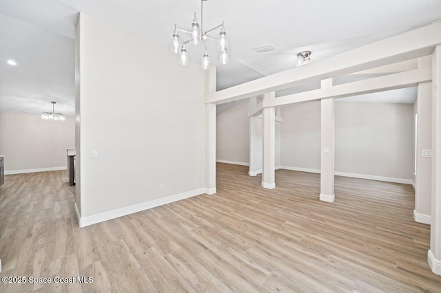 5863 Newbury Cir, Melbourne, FL 32940 - below grade area with light wood-type flooring, a chandelier, and baseboards