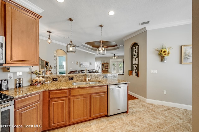1409 Corbett Ln, Melbourne, FL 32904 - kitchen featuring appliances with stainless steel finishes, a sink, arched walkways, a ceiling fan, and ornamental molding