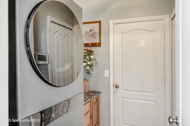 1409 Corbett Ln, Melbourne, FL 32904 - laundry room featuring stacked washer / dryer