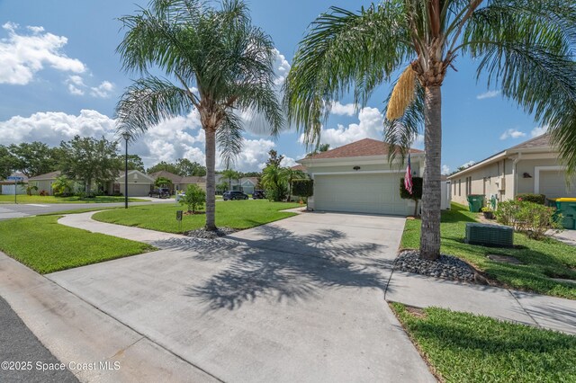 1409 Corbett Ln, Melbourne, FL 32904 - view of front of home with driveway, an attached garage, a front yard, a residential view, and central AC