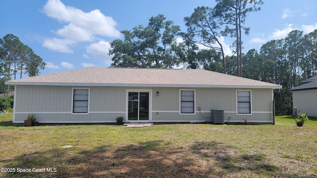 333 Galena St SW, Palm Bay, FL 32908 - back of house featuring a yard and central air condition unit
