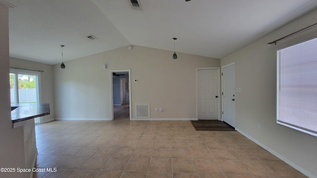333 Galena St SW, Palm Bay, FL 32908 - unfurnished living room featuring lofted ceiling, light tile patterned floors, baseboards, and ceiling fan