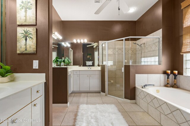 448 Birchington Ln, Melbourne, FL 32940 - bathroom featuring ceiling fan, two vanities, and tile patterned flooring