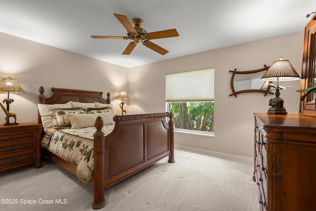 448 Birchington Ln, Melbourne, FL 32940 - bedroom featuring light carpet, baseboards, and a ceiling fan