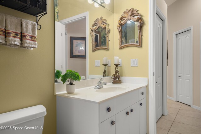 448 Birchington Ln, Melbourne, FL 32940 - half bathroom with vanity, tile patterned flooring, and toilet