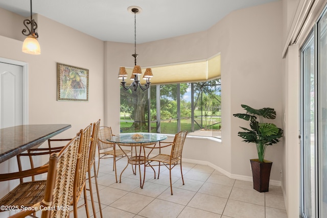 448 Birchington Ln, Melbourne, FL 32940 - dining room featuring light tile patterned floors, a chandelier, and baseboards