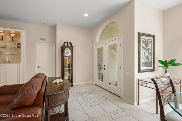 448 Birchington Ln, Melbourne, FL 32940 - entryway with light tile patterned floors, french doors, baseboards, and recessed lighting