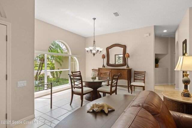 448 Birchington Ln, Melbourne, FL 32940 - dining space with light tile patterned floors, baseboards, a chandelier, and recessed lighting