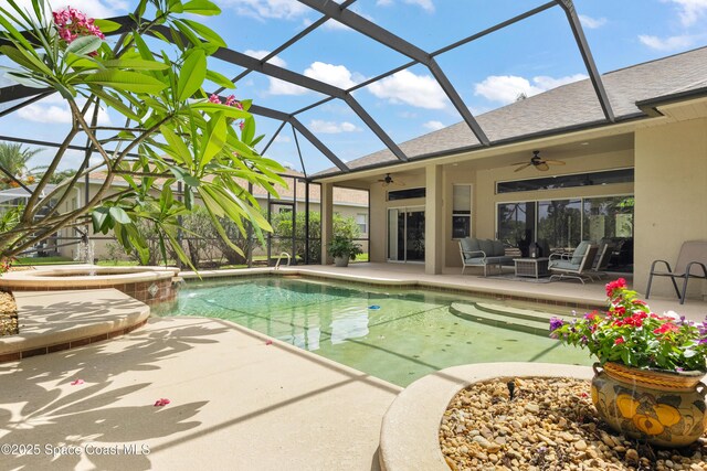448 Birchington Ln, Melbourne, FL 32940 - view of swimming pool with a ceiling fan, a patio, outdoor lounge area, glass enclosure, and a pool with connected hot tub