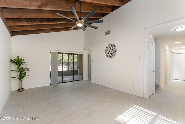3444 Partridge Ct, Melbourne, FL 32935 - unfurnished room with a ceiling fan, beamed ceiling, baseboards, and high vaulted ceiling