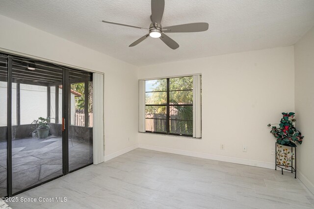3444 Partridge Ct, Melbourne, FL 32935 - unfurnished room with ceiling fan, a textured ceiling, and baseboards