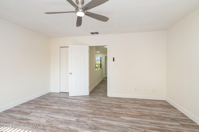 3444 Partridge Ct, Melbourne, FL 32935 - empty room featuring light wood-style floors, ceiling fan, and baseboards