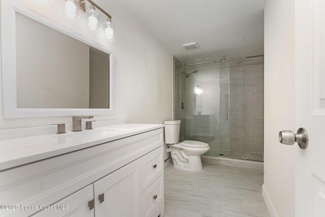 3444 Partridge Ct, Melbourne, FL 32935 - full bathroom with toilet, a stall shower, marble finish floors, vanity, and a textured ceiling