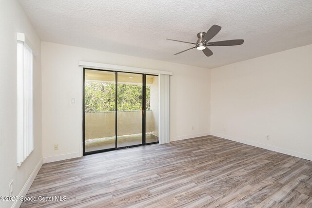 3444 Partridge Ct, Melbourne, FL 32935 - unfurnished room with wood finished floors, ceiling fan, a textured ceiling, and baseboards