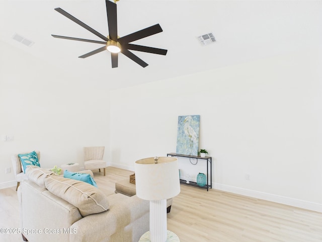 8116 97th Ct, Vero Beach, FL 32967 - living room featuring wood finished floors, baseboards, and ceiling fan