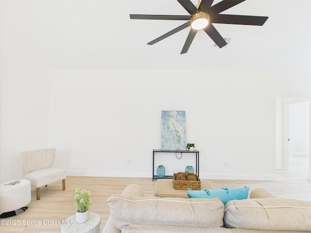 8116 97th Ct, Vero Beach, FL 32967 - living area with baseboards, light wood-style floors, and a ceiling fan