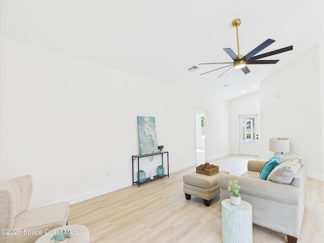 8116 97th Ct, Vero Beach, FL 32967 - living room featuring lofted ceiling, light wood finished floors, baseboards, and a ceiling fan